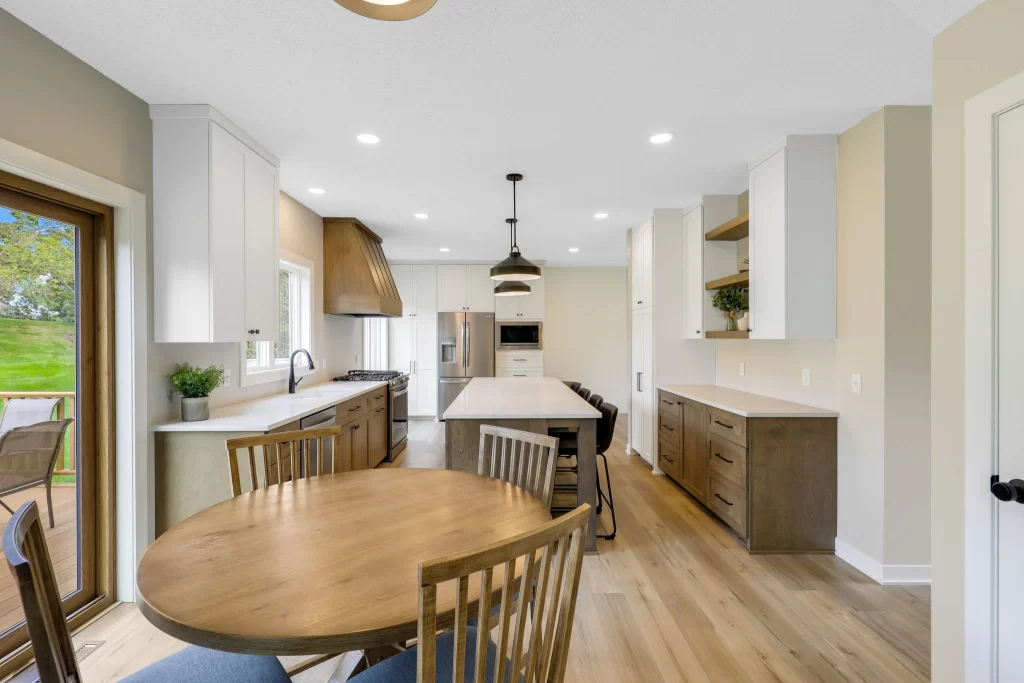 Hastings Hideaway After - brown kitchen with dining room- Custom One Renovation